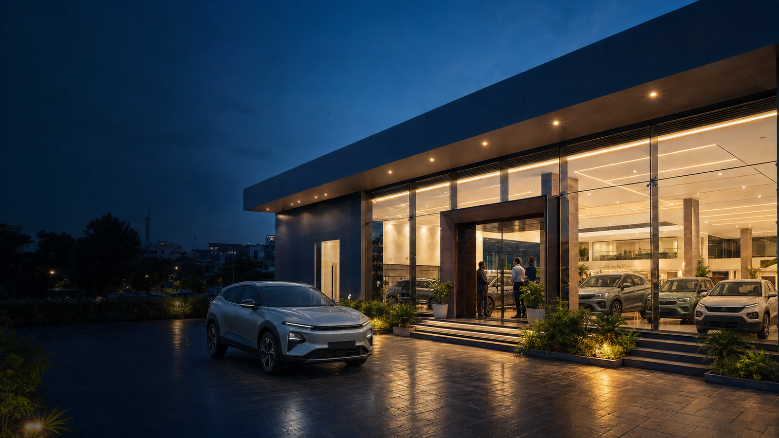 A premium Kamu Motors showroom at blue hour